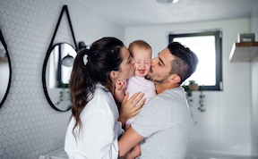 Happy Couple with Baby After Vasectomy Reversal